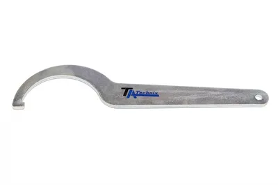 Adjustment spanner for coil spring strut