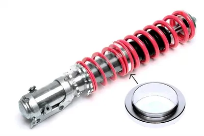 Intermediate spring plate for height adjustment